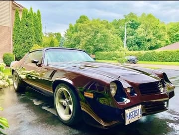 Deep burgundy second-generation Camaro photographed after finishing work